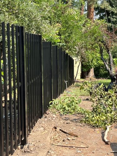 Black metal fencing to add extra protection for property.