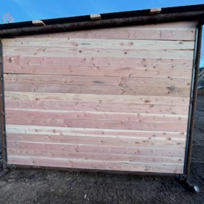 Side view of a custom mobile livestock shelter